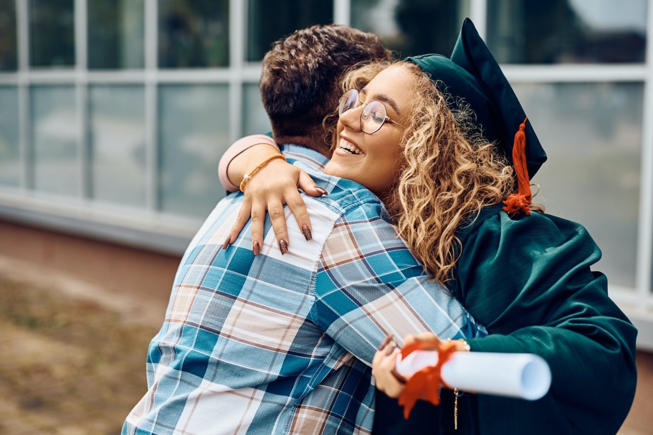 happy-student-hugging-her-father-after-receiving-diploma-on-graduation-day-at-the-university-.jpg